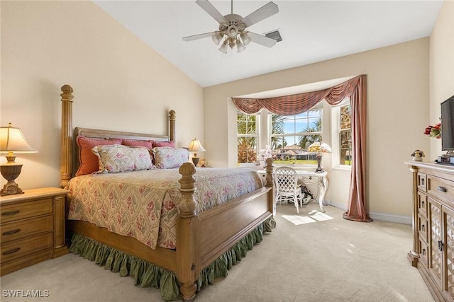 bedroom featuring light colored carpet, a ceiling fan, baseboards, and vaulted ceiling