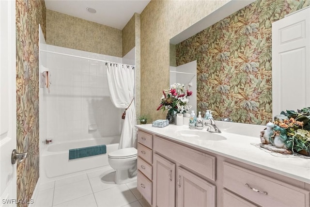 bathroom with vanity, wallpapered walls, tile patterned flooring, shower / tub combo, and toilet