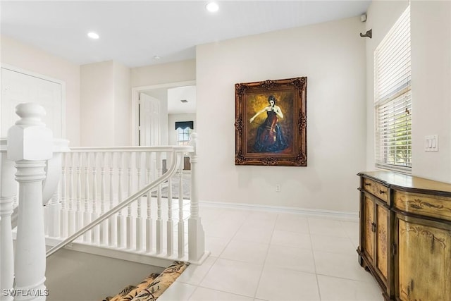 5979 Trophy Dr Unit 1604, Naples, FL 34110 - hall with an upstairs landing, baseboards, recessed lighting, and light tile patterned flooring