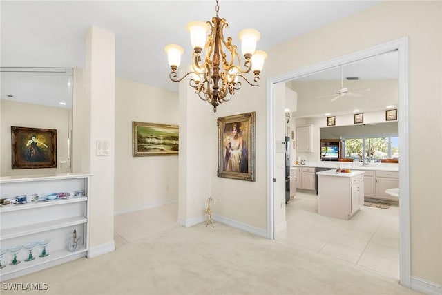 5979 Trophy Dr Unit 1604, Naples, FL 34110 - hall with a chandelier, light tile patterned floors, baseboards, and light carpet