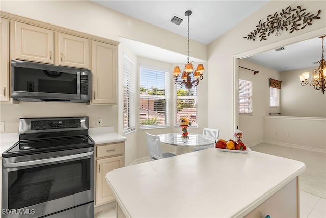 5979 Trophy Dr Unit 1604, Naples, FL 34110 - kitchen with electric stove, a chandelier, light countertops, and plenty of natural light