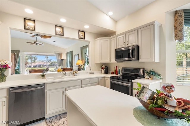 5979 Trophy Dr Unit 1604, Naples, FL 34110 - kitchen featuring stainless steel appliances, a sink, lofted ceiling, ceiling fan, and light countertops