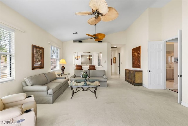 5979 Trophy Dr Unit 1604, Naples, FL 34110 - living area featuring a ceiling fan, vaulted ceiling, light colored carpet, and baseboards