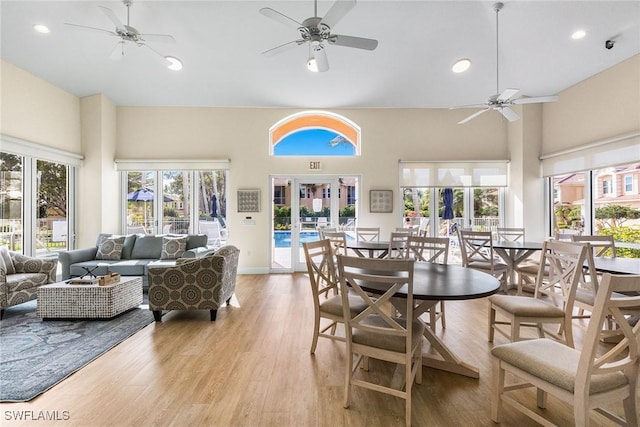 5979 Trophy Dr Unit 1604, Naples, FL 34110 - dining area featuring ceiling fan, a towering ceiling, light wood-style flooring, and recessed lighting
