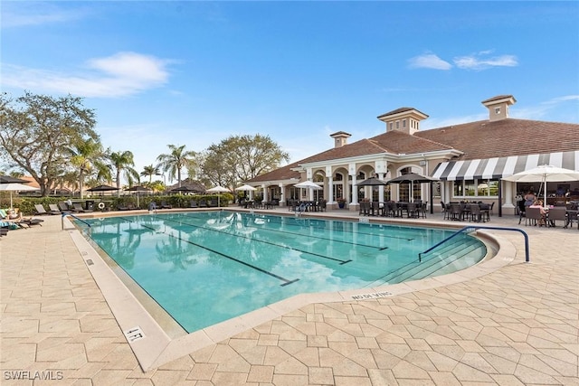 5979 Trophy Dr Unit 1604, Naples, FL 34110 - community pool featuring a patio area