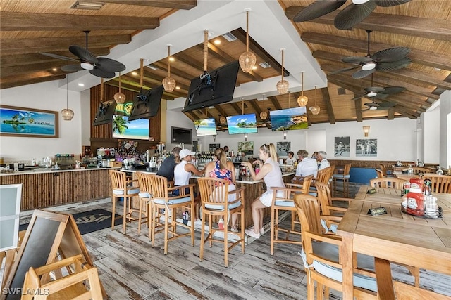 5979 Trophy Dr Unit 1604, Naples, FL 34110 - dining room featuring a ceiling fan, wooden ceiling with exposed beams, wood finished floors, and high vaulted ceiling