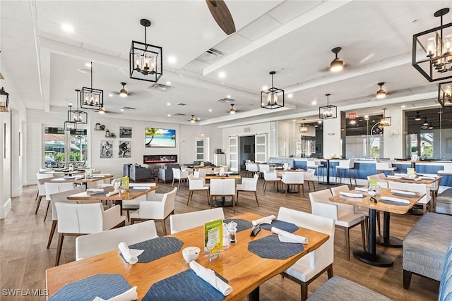 5979 Trophy Dr Unit 1604, Naples, FL 34110 - dining space with wood finished floors, a ceiling fan, a chandelier, and recessed lighting