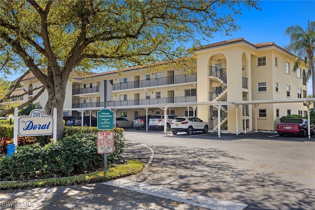 view of property featuring uncovered parking