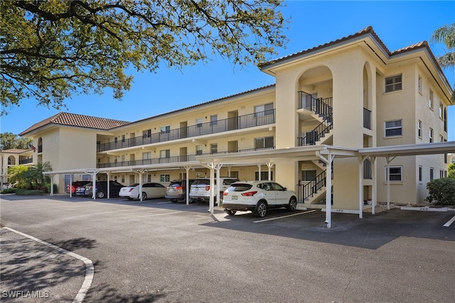 view of property featuring covered parking