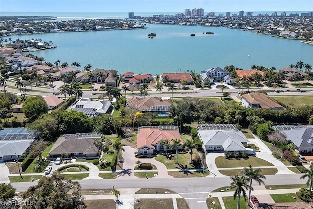 aerial view with a residential view and a water view