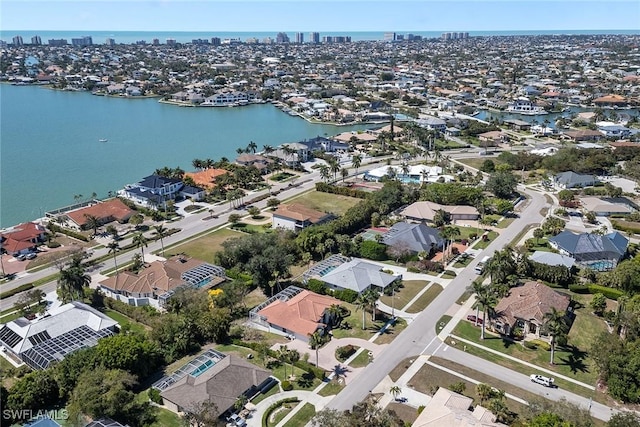 bird's eye view with a water view and a residential view