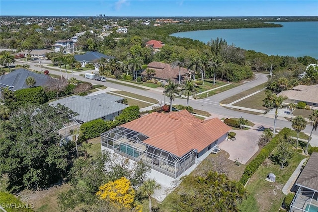 drone / aerial view with a residential view and a water view