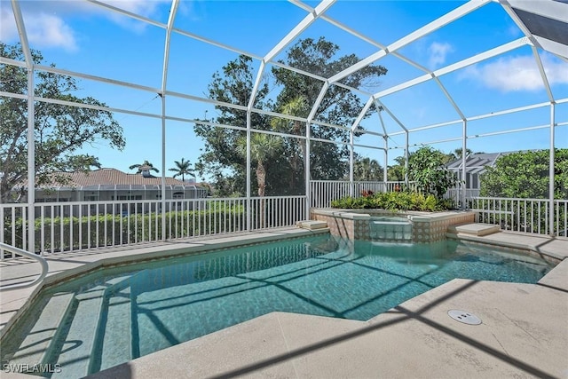 view of pool featuring glass enclosure, a patio, fence, and a pool with connected hot tub