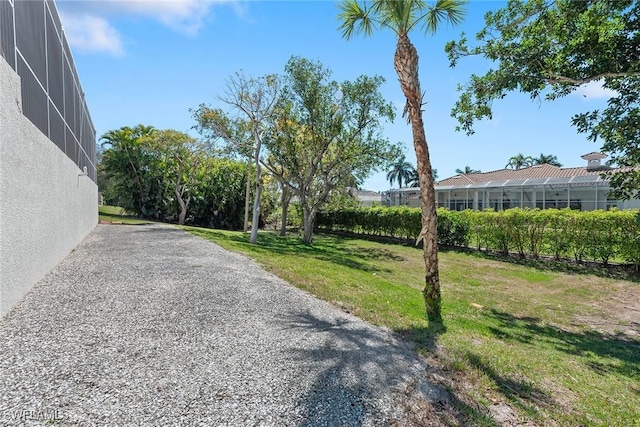 view of yard with a lanai