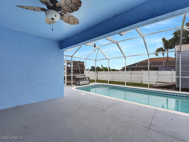 view of swimming pool with a patio, fence, a lanai, a fenced in pool, and ceiling fan