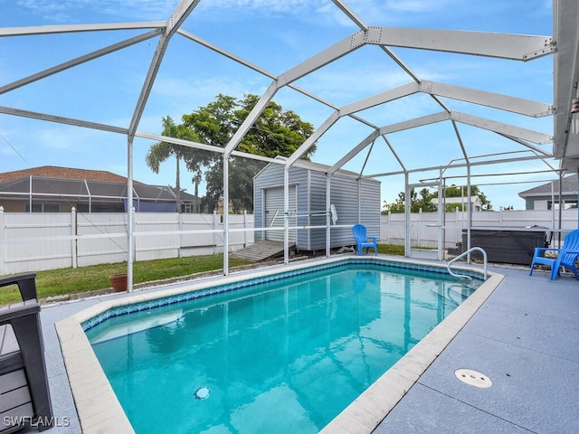 view of pool with a patio, a fenced in pool, a shed, a fenced backyard, and an outdoor structure