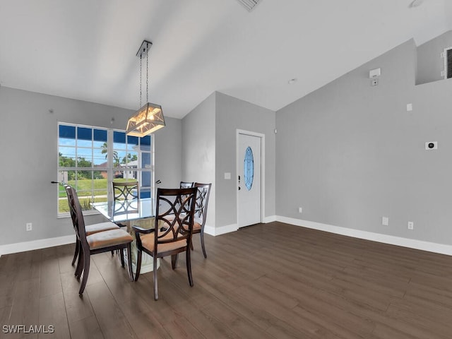 dining space featuring dark wood-style floors, baseboards, and vaulted ceiling