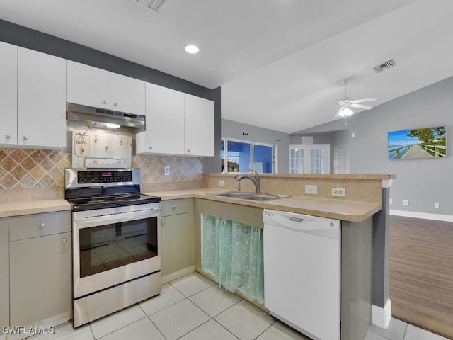 kitchen with visible vents, under cabinet range hood, dishwasher, stainless steel range with electric stovetop, and a sink