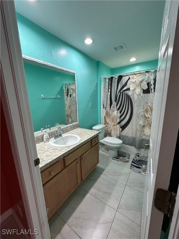 bathroom with visible vents, toilet, a shower with curtain, recessed lighting, and vanity