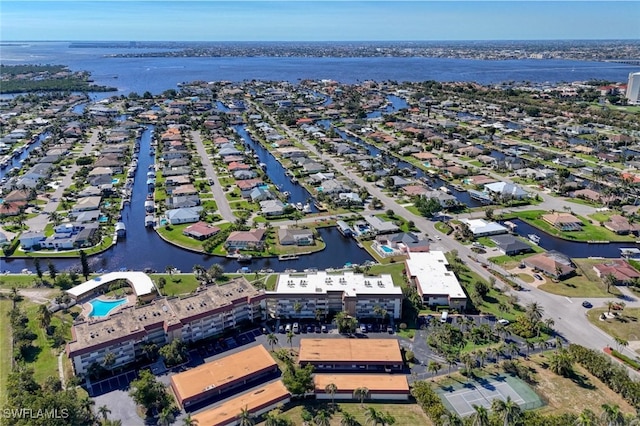 bird's eye view with a residential view and a water view