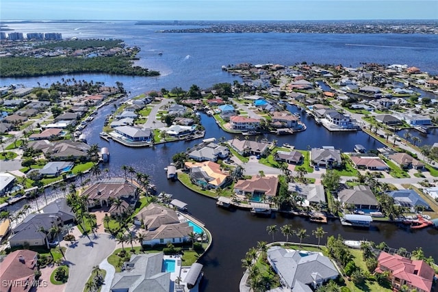 aerial view with a residential view and a water view