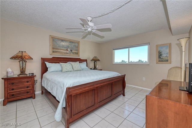 bedroom with baseboards, a textured ceiling, and ceiling fan