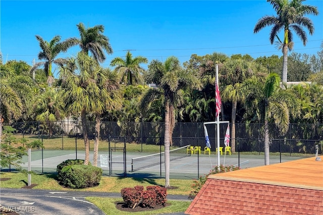 view of tennis court with fence