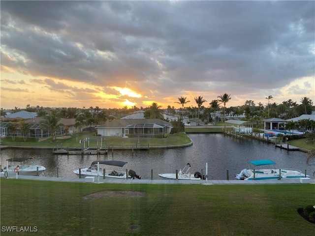 water view with a dock and a residential view