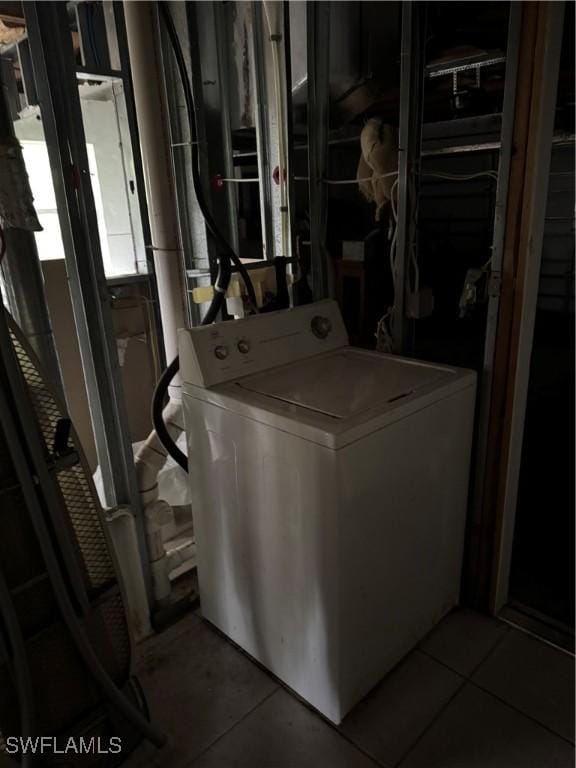 laundry area with laundry area and washer / dryer