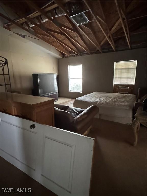 bedroom featuring lofted ceiling