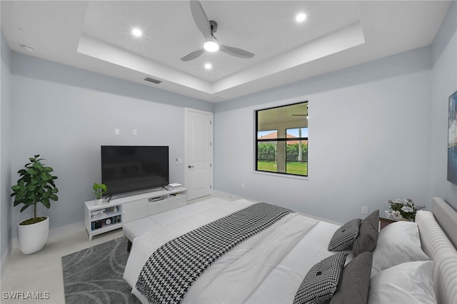 bedroom featuring visible vents, baseboards, recessed lighting, a raised ceiling, and a ceiling fan