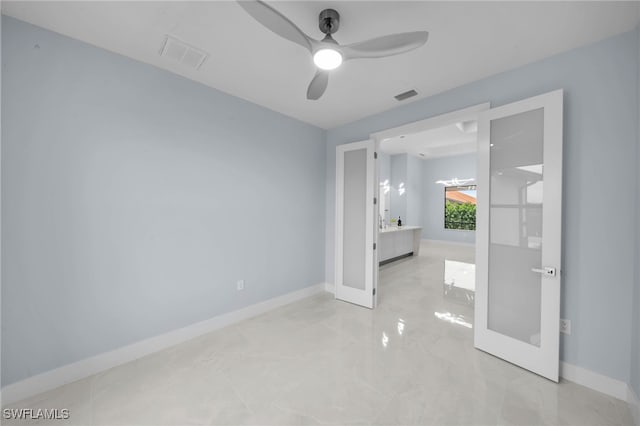 unfurnished bedroom with french doors, baseboards, and visible vents