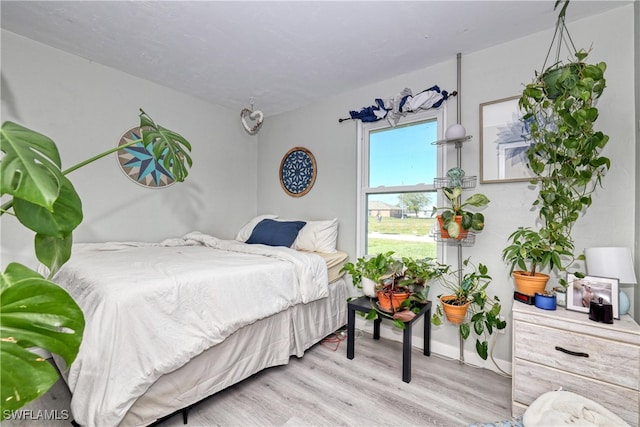 bedroom featuring wood finished floors