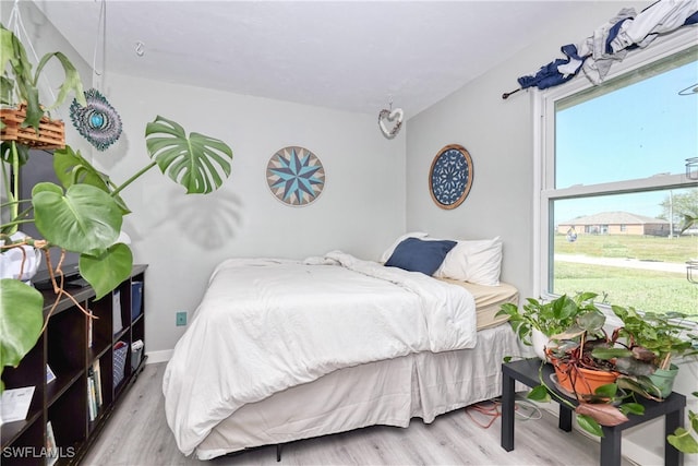 bedroom with wood finished floors