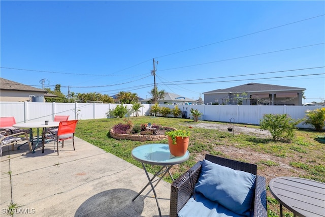 view of patio with outdoor dining area and a fenced backyard