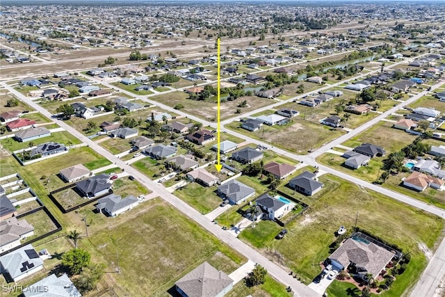 birds eye view of property with a residential view