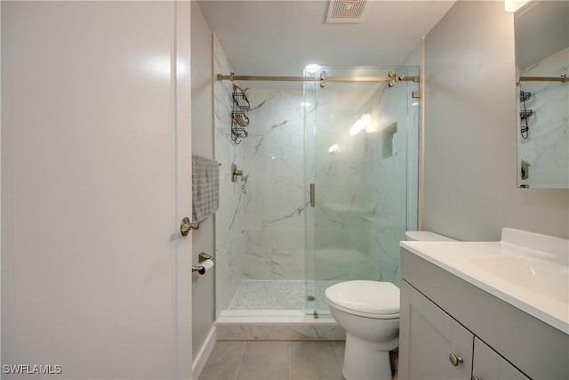 bathroom featuring toilet, visible vents, and a marble finish shower