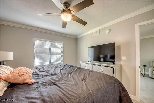 bedroom featuring a ceiling fan, visible vents, baseboards, light tile patterned flooring, and crown molding