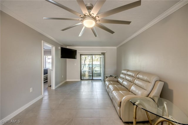 living room featuring light tile patterned floors, ceiling fan, crown molding, and baseboards