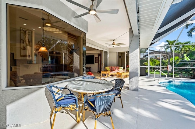 view of patio with a lanai, an outdoor living space, an outdoor pool, and ceiling fan