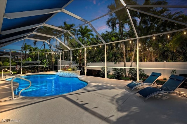 pool at dusk featuring a lanai, a fenced in pool, a fenced backyard, and a patio area