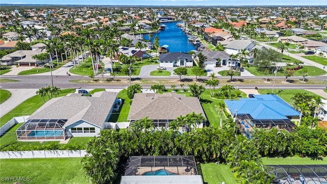 bird's eye view featuring a residential view and a water view