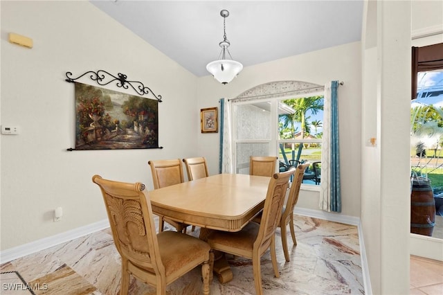 dining area with baseboards and marble finish floor