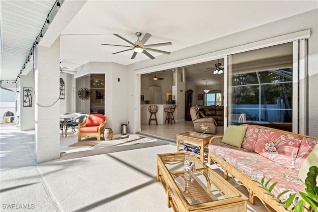 exterior space with ceiling fan