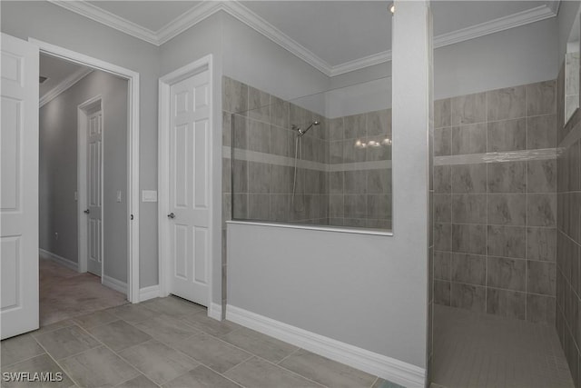 full bath with baseboards, crown molding, and a walk in shower