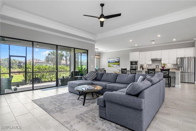 living area with ceiling fan, light tile patterned floors, recessed lighting, and ornamental molding