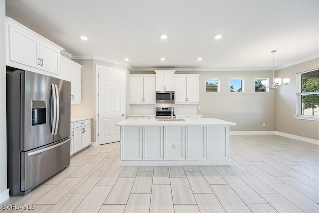 kitchen featuring a sink, stainless steel appliances, a chandelier, and light countertops