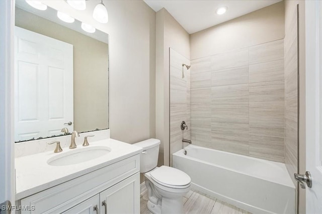 full bath featuring vanity, toilet, and shower / bathtub combination