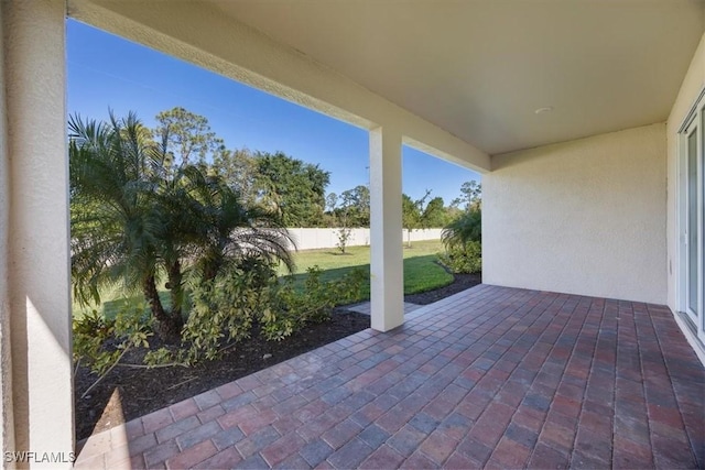 view of patio / terrace featuring fence