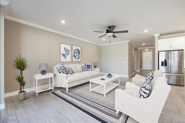 living room with baseboards, ornamental molding, and a ceiling fan